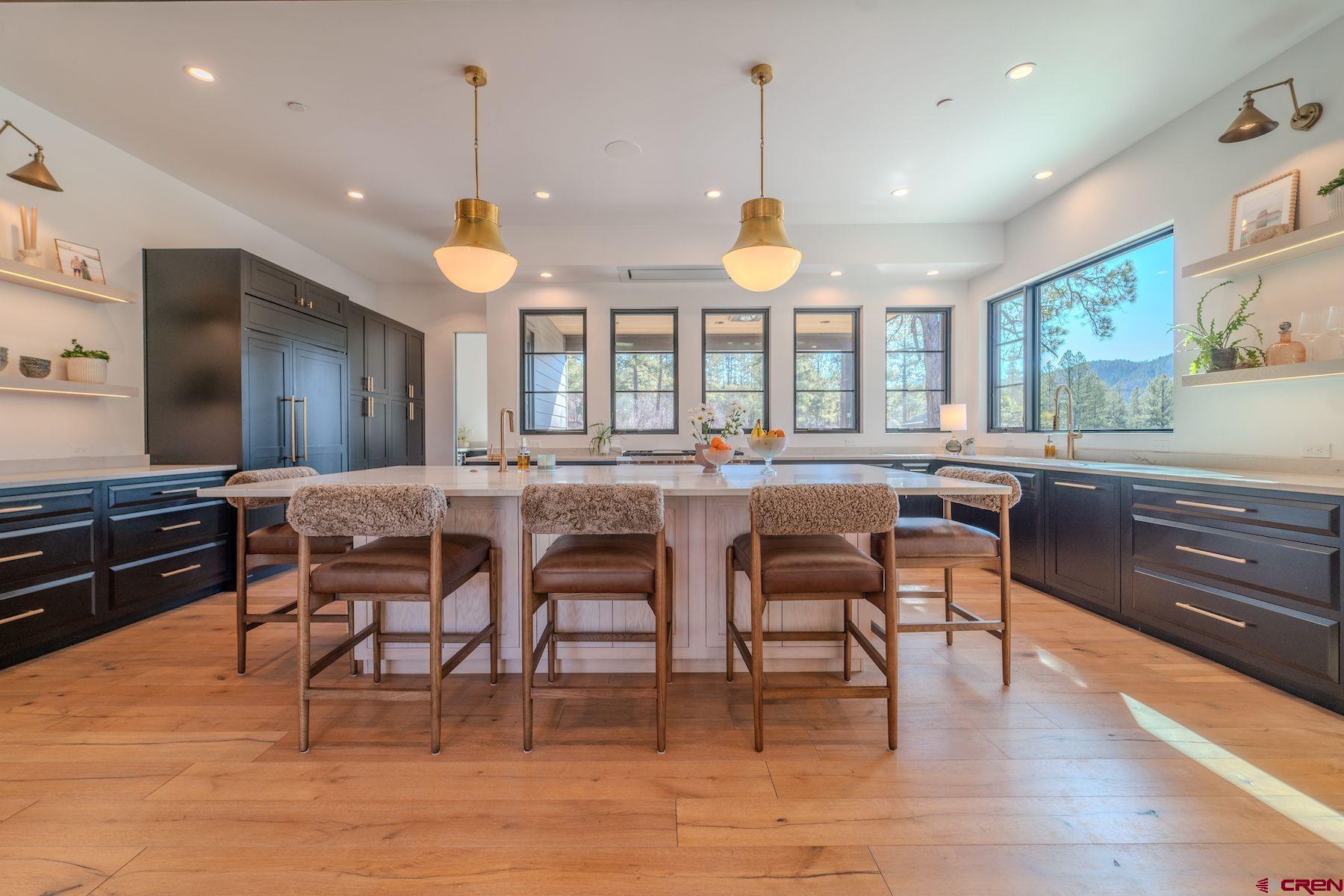 46 Bell Flower Court Durango, CO 81301 - Photo 5 of 40 a view of a dining room with furniture window and wooden floor
