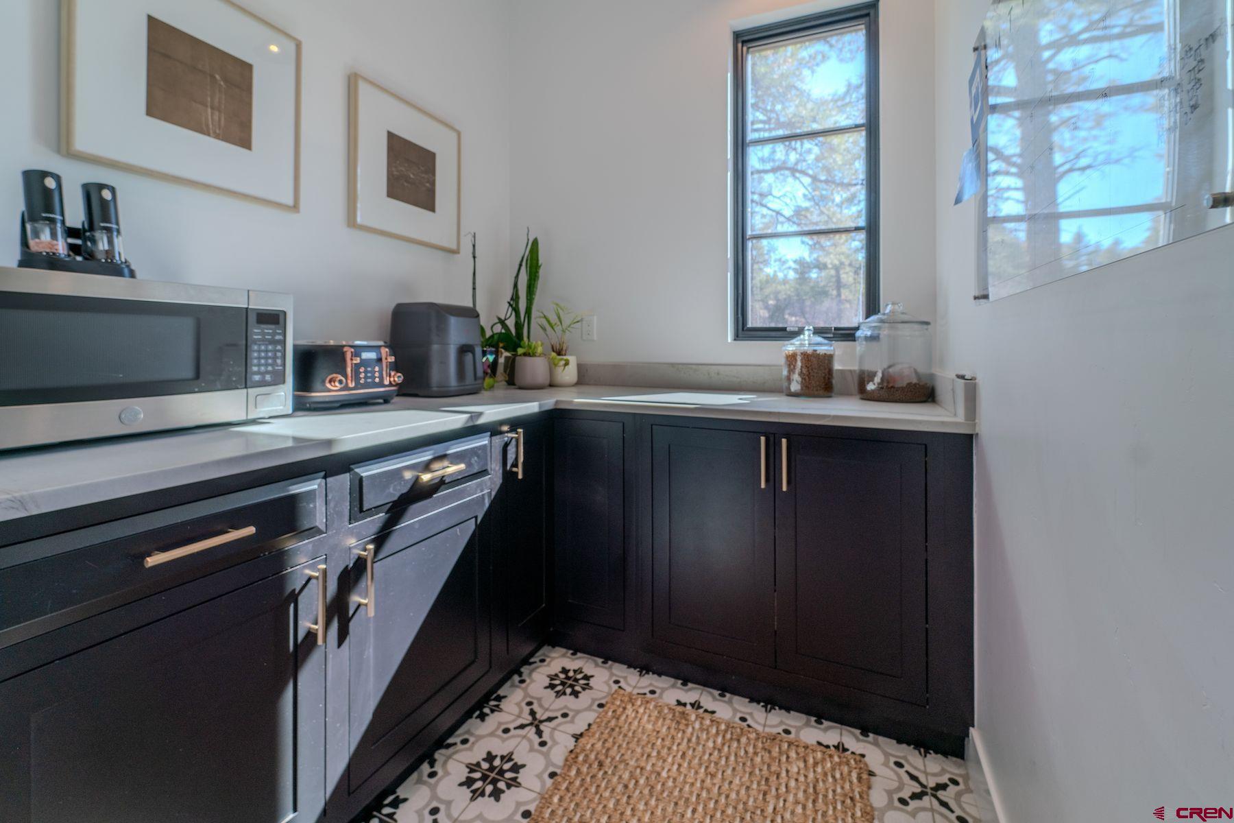 46 Bell Flower Court Durango, CO 81301 - Photo 8 of 40 a kitchen with a sink and cabinets