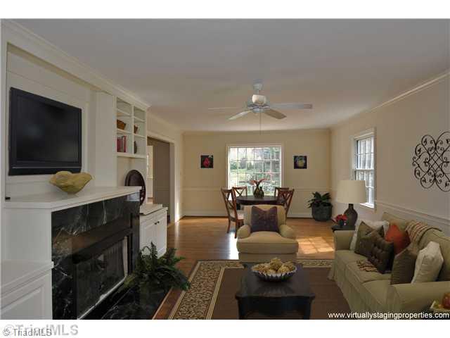 635 Roslyn Road Winston-Salem, NC 27104 - Photo 8 of 15 Den/Family/Great Room. Virtual Staging in Family Room exhibits versatility.