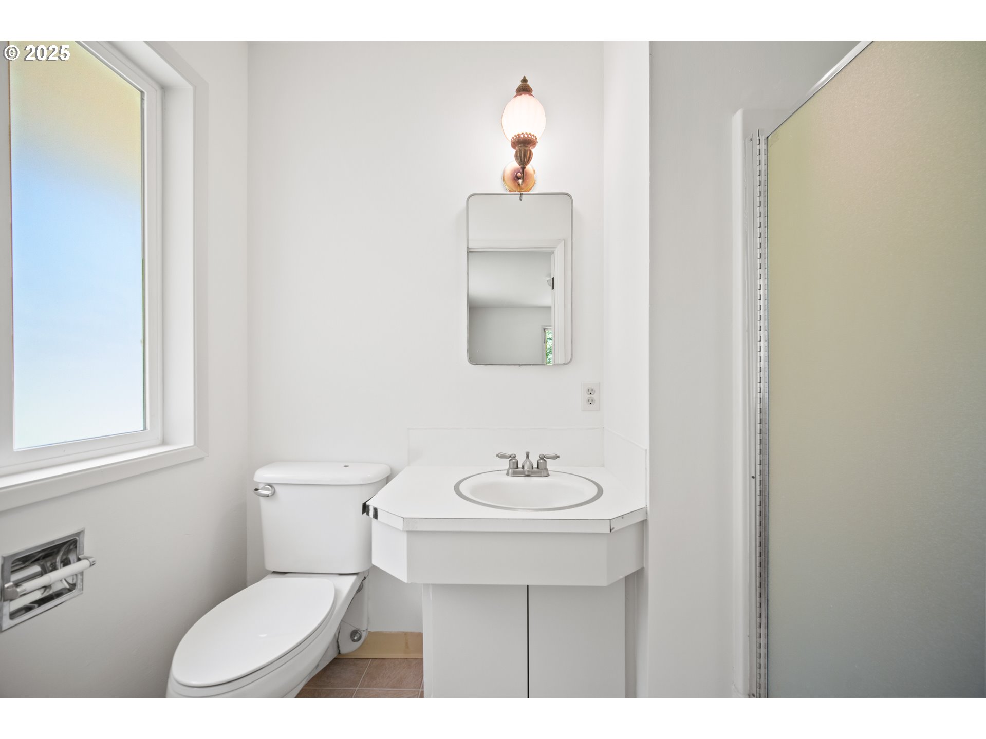 1339 Southwest 27th Court Gresham, OR 97080 - Photo 15 of 41 a bathroom with a toilet a sink and mirror