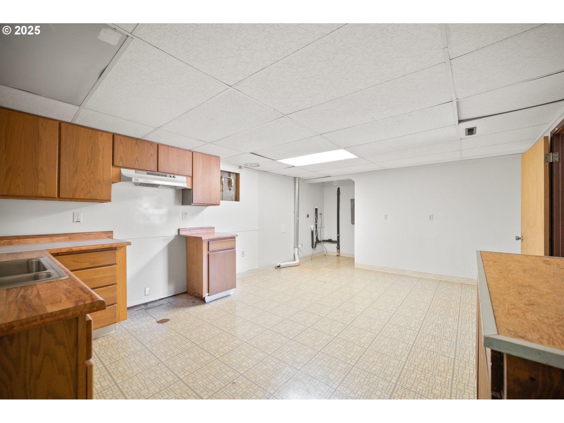 1339 Southwest 27th Court Gresham, OR 97080 - Photo 22 of 41 a kitchen with a sink stove and cabinets