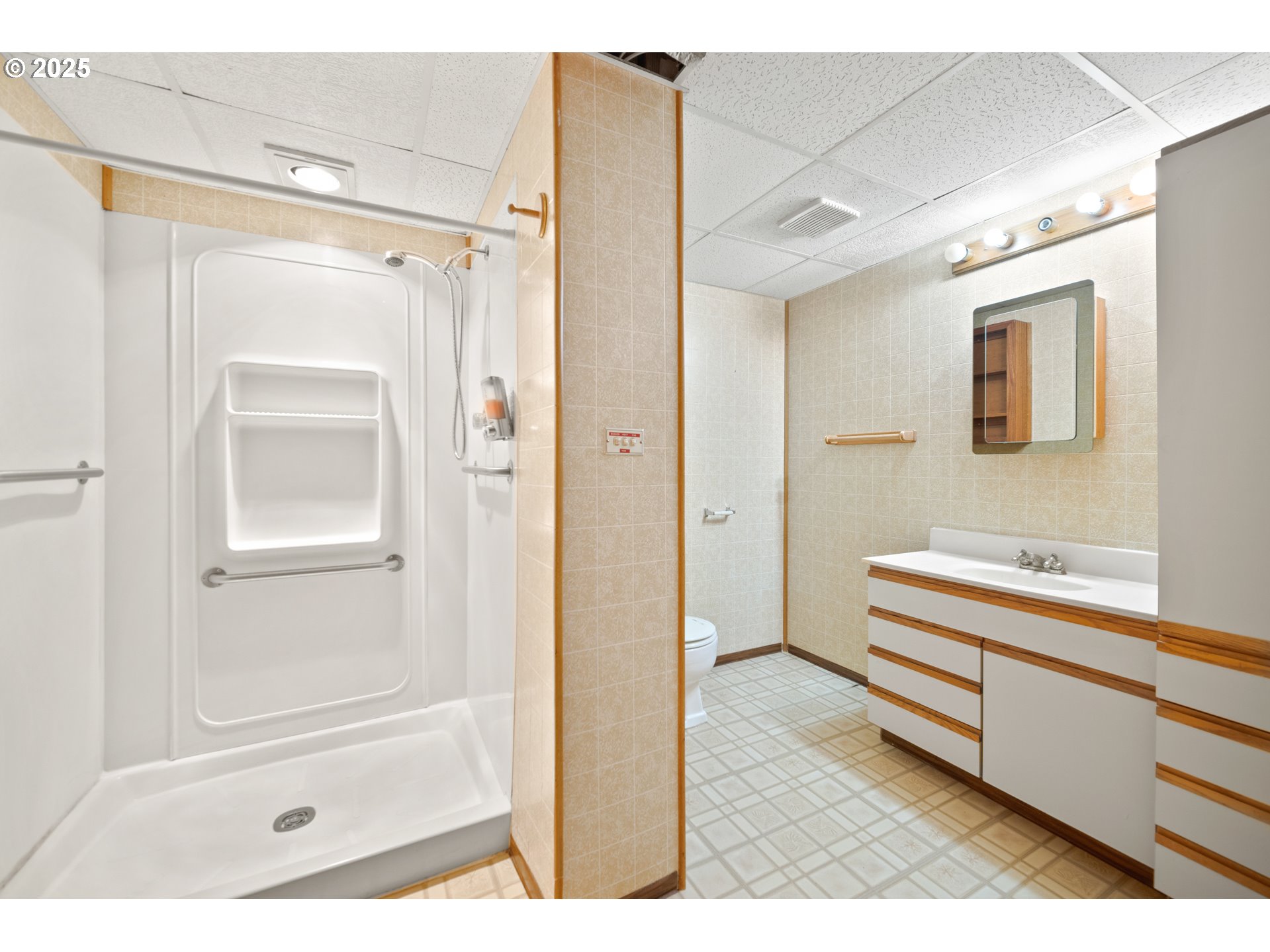 1339 Southwest 27th Court Gresham, OR 97080 - Photo 23 of 41 a bathroom with a tub shower vanity and a sink