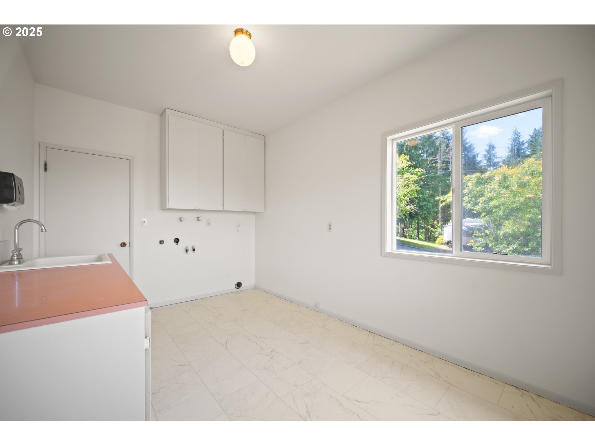 1339 Southwest 27th Court Gresham, OR 97080 - Photo 28 of 41 a kitchen with a sink cabinets and window