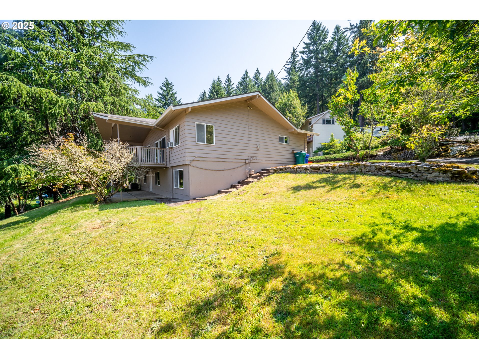 1339 Southwest 27th Court Gresham, OR 97080 - Photo 40 of 41 a house view with a swimming pool