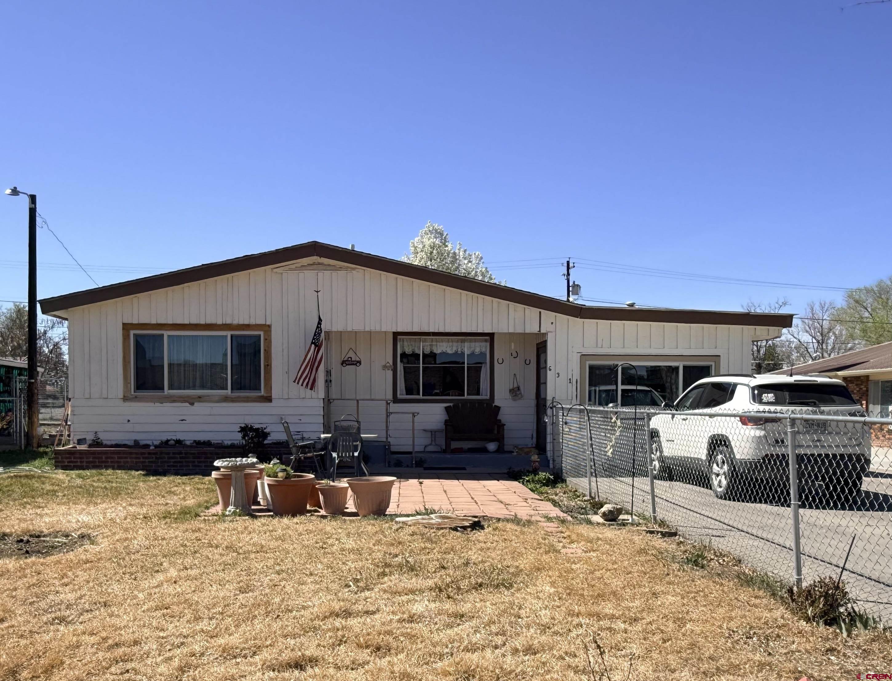 631 A Street Delta, CO 81416 - Photo 1 of 25 a view of a house with a patio