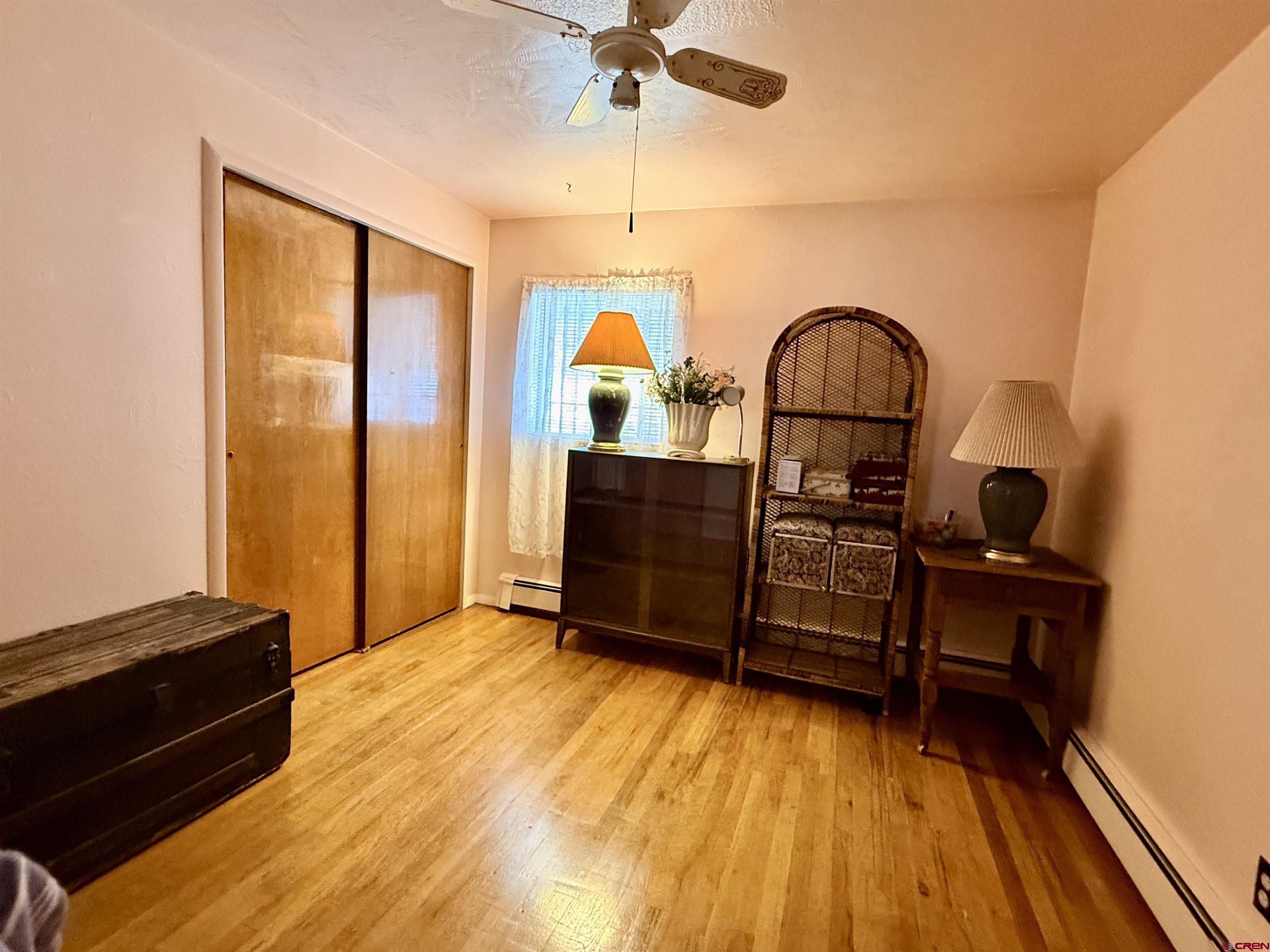 631 A Street Delta, CO 81416 - Photo 18 of 25 a bedroom with a bed and a dresser