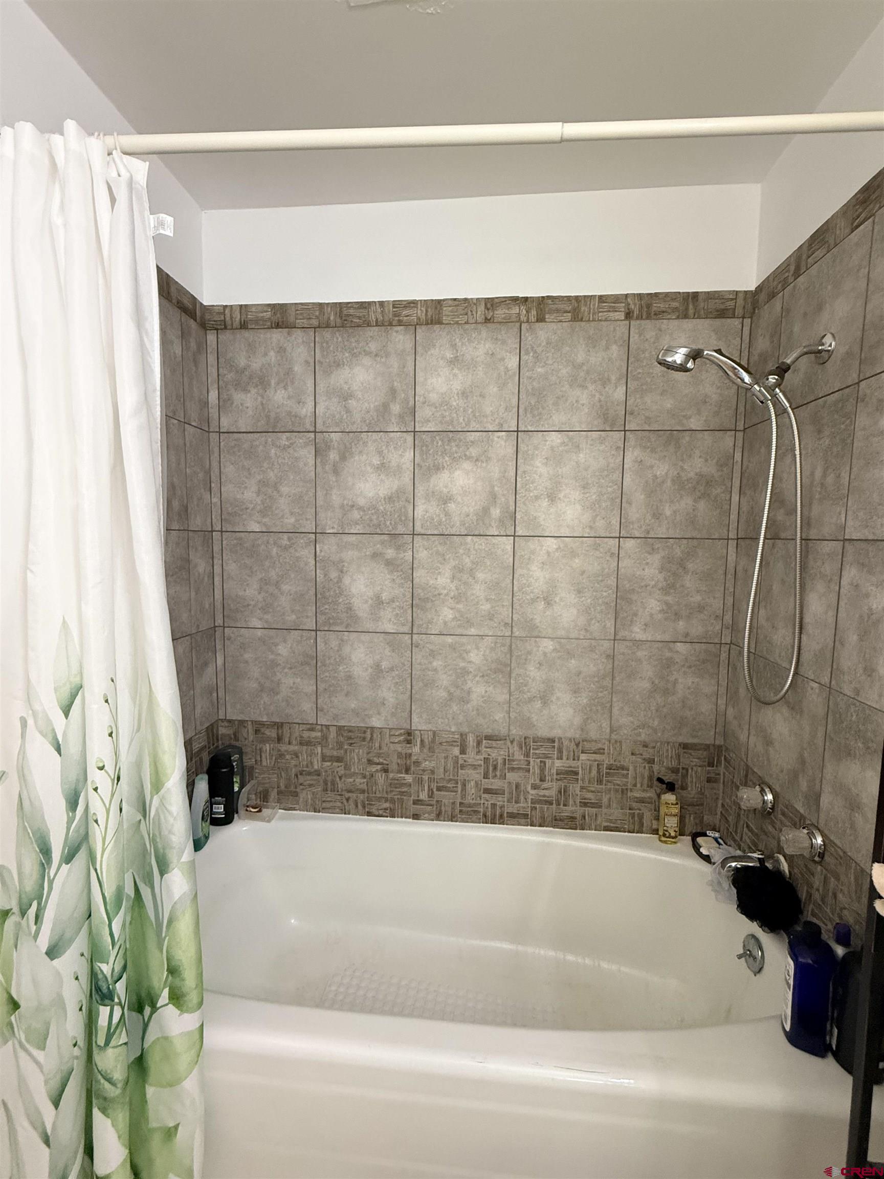 631 A Street Delta, CO 81416 - Photo 23 of 25 a bathroom with a bathtub and shower