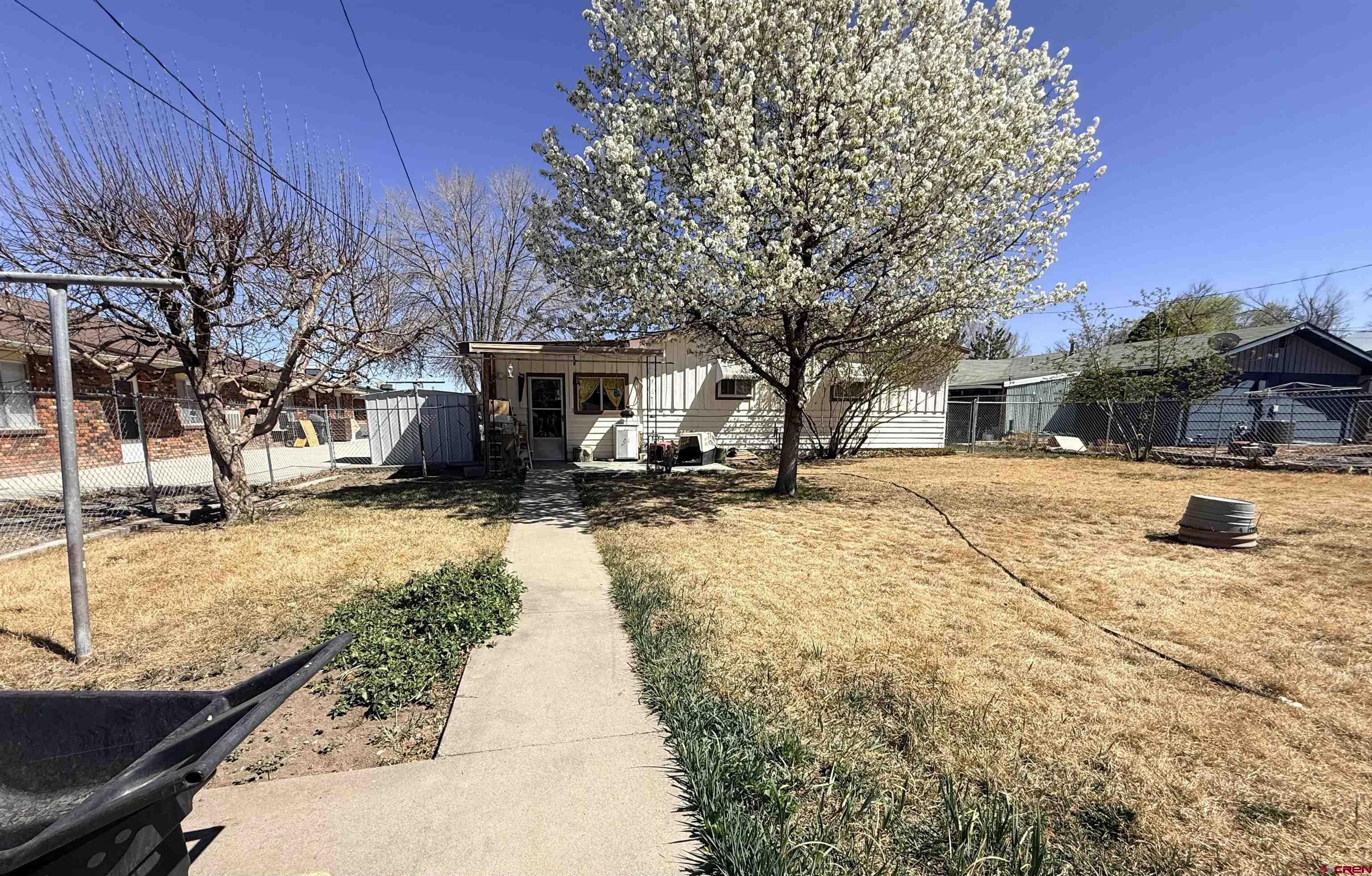 631 A Street Delta, CO 81416 - Photo 3 of 25 a view of a yard with snow on the road