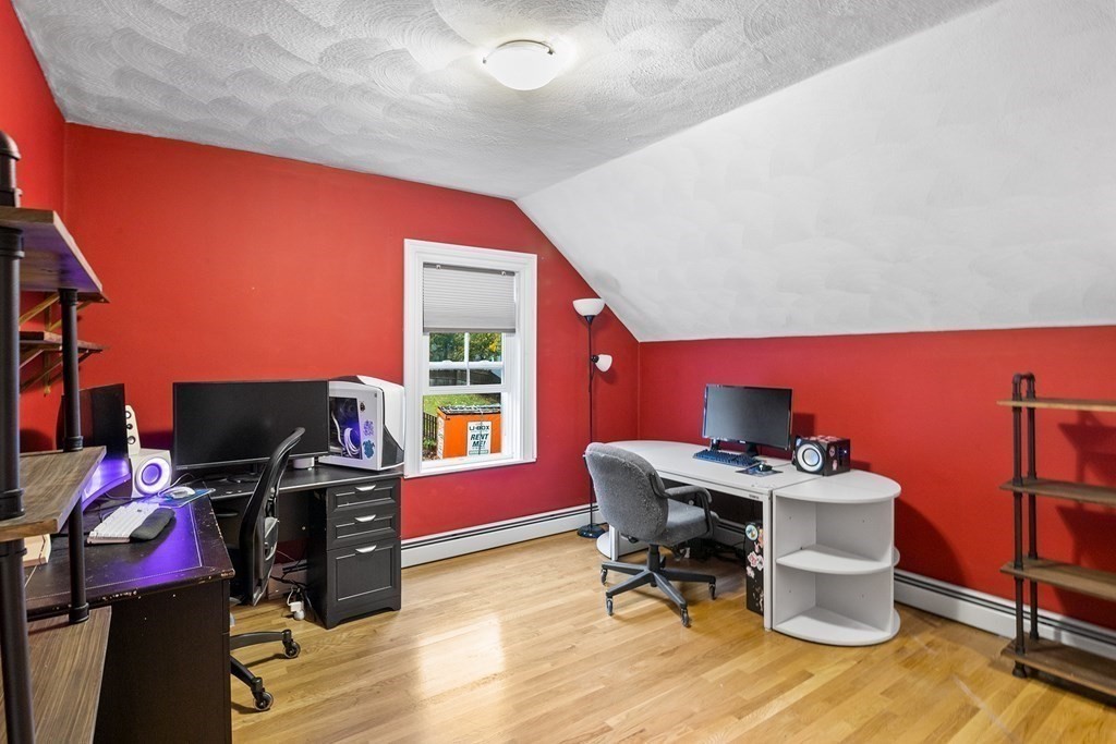 868 Main Street Reading, MA 01867 - Photo 15 of 32 a view of a workspace with furniture and a window