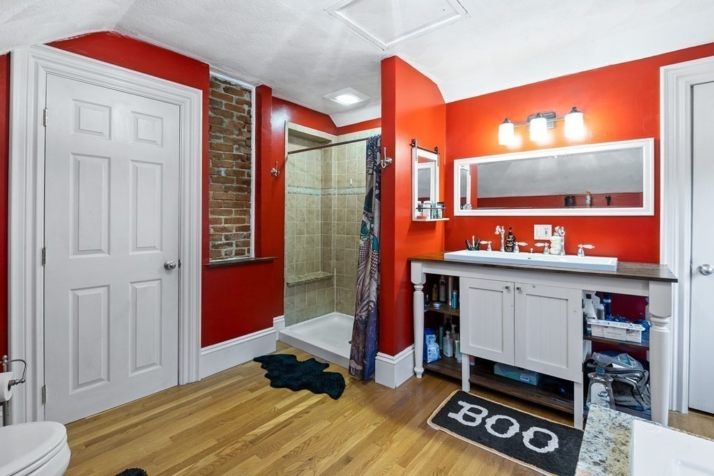 868 Main Street Reading, MA 01867 - Photo 19 of 32 a bed room with a bed and a window