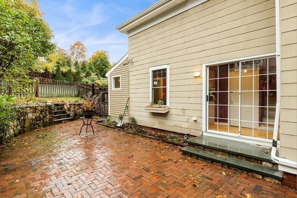 868 Main Street Reading, MA 01867 - Photo 23 of 32 a backyard of a house with outdoor seating