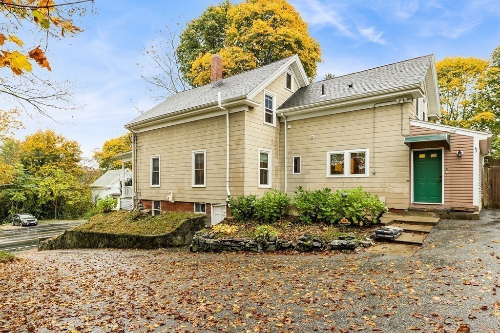 868 Main Street Reading, MA 01867 - Photo 26 of 32 a front view of a house with garden