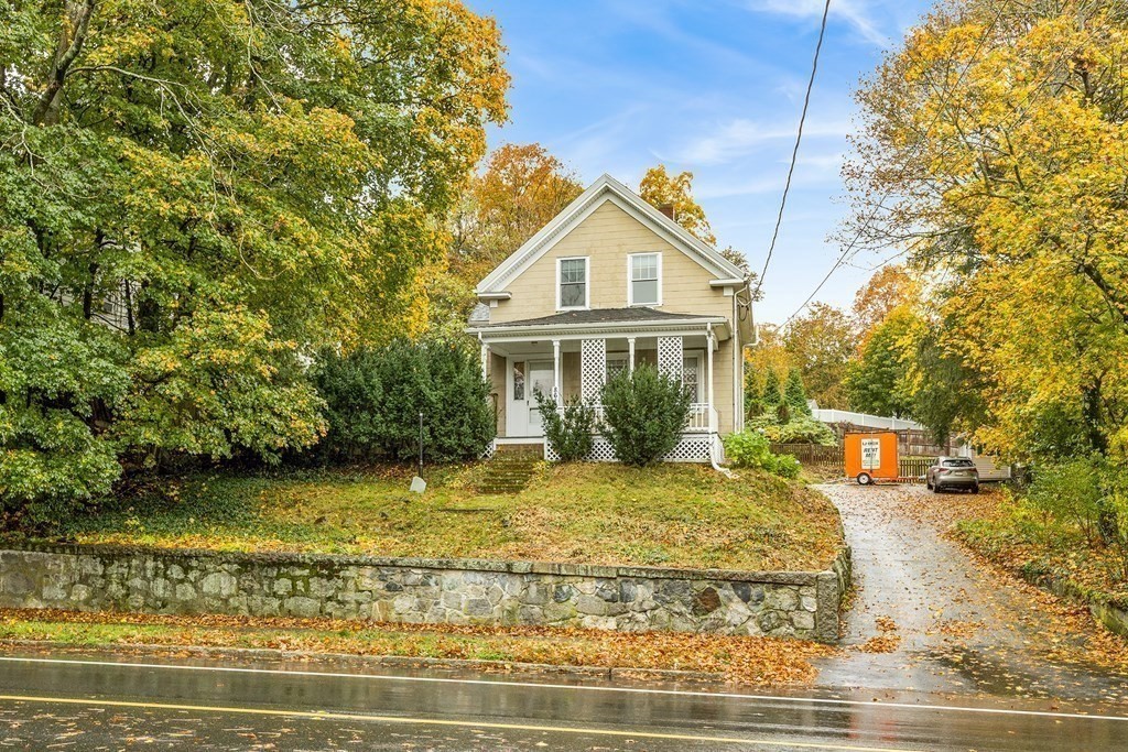 868 Main Street Reading, MA 01867 - Photo 29 of 32 a front view of a house with a yard