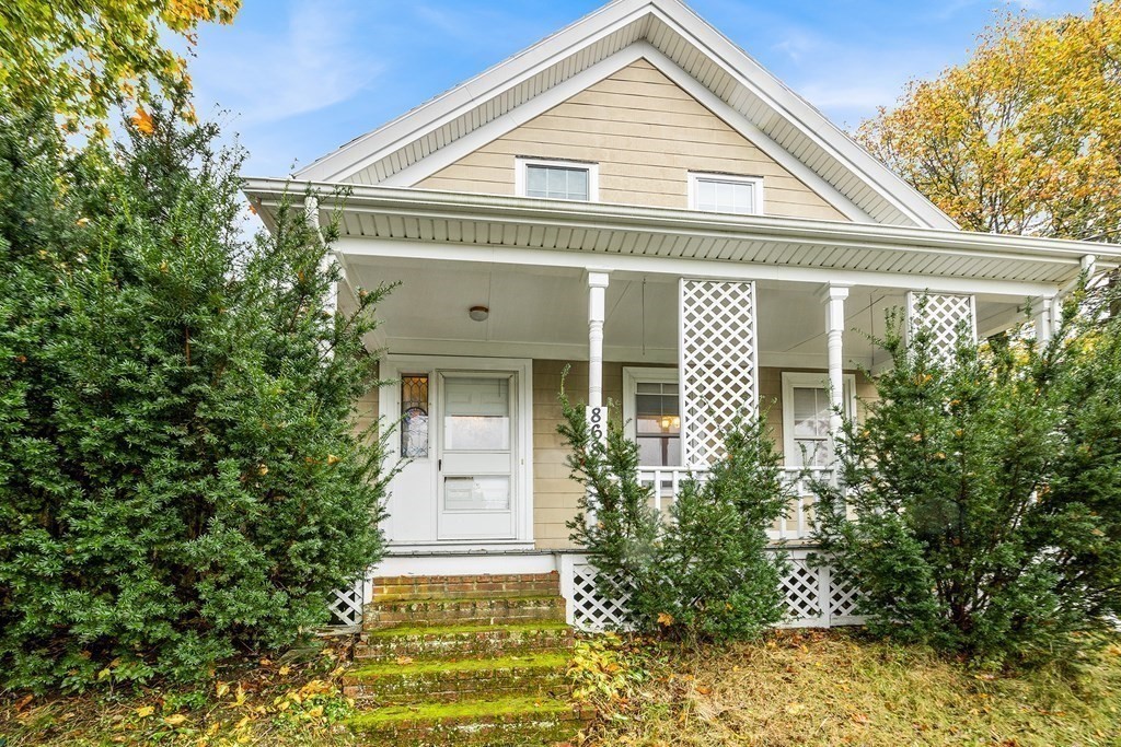 868 Main Street Reading, MA 01867 - Photo 3 of 32 a front view of a house with a yard