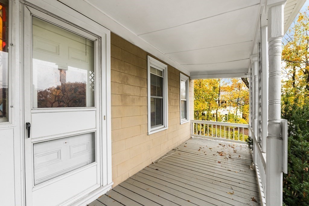 868 Main Street Reading, MA 01867 - Photo 4 of 32 a view of a house with a porch