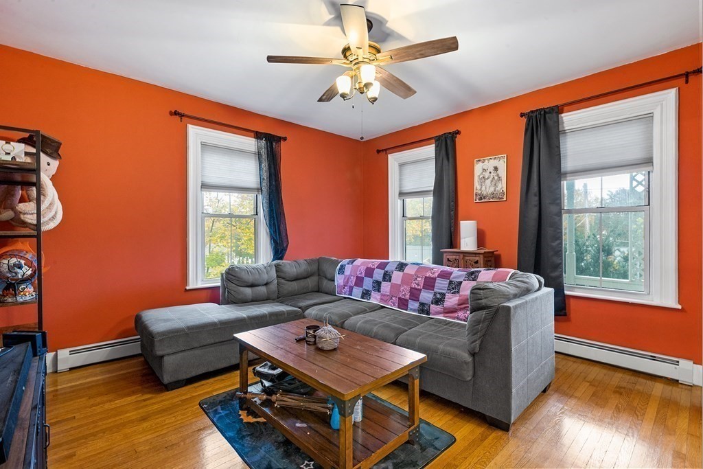 868 Main Street Reading, MA 01867 - Photo 5 of 32 a living room with furniture and a large window