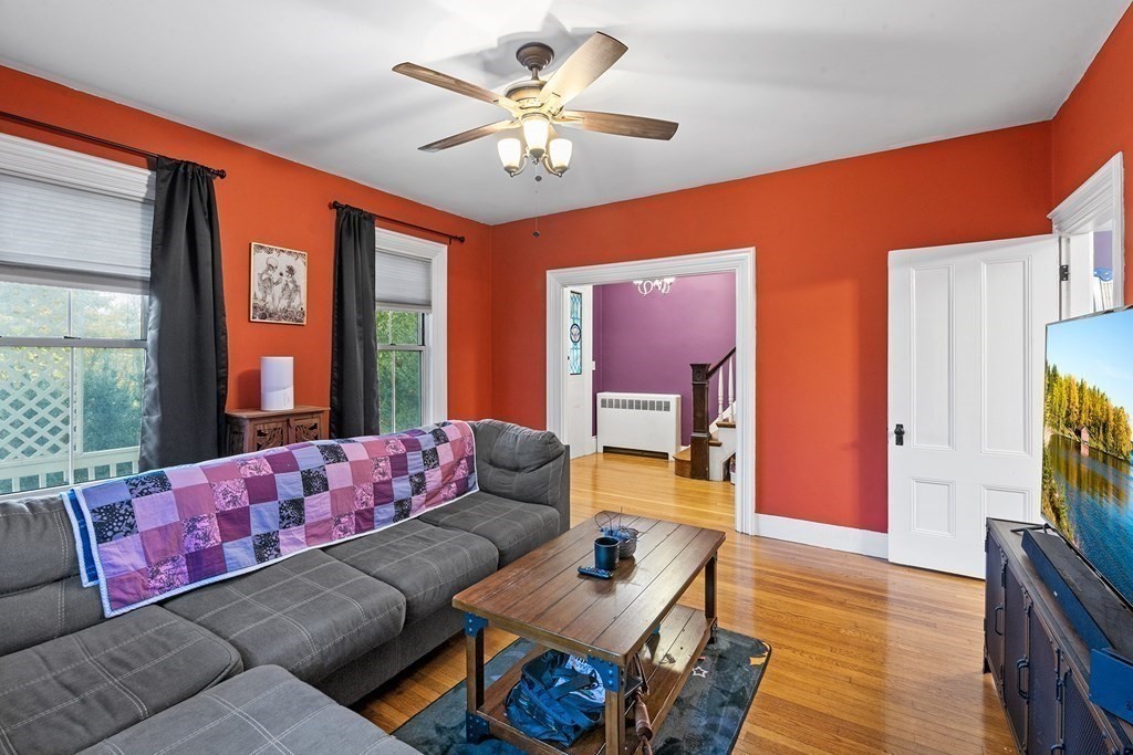 868 Main Street Reading, MA 01867 - Photo 6 of 32 a living room with furniture and a flat screen tv