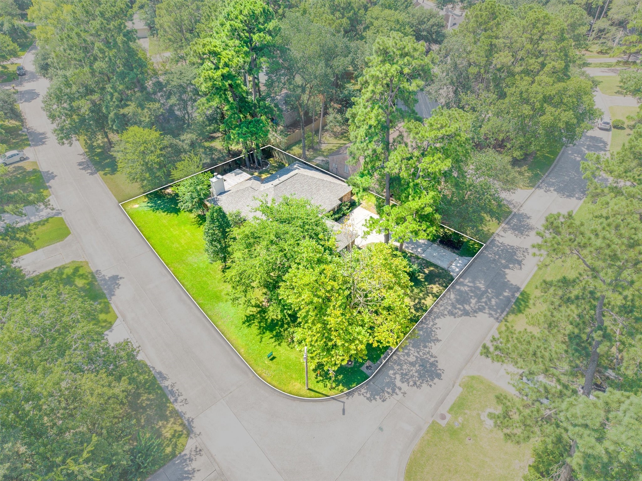 3 Still Corner Place Spring, TX 77381 - Photo 30 of 34 From above, you can really see it, this is a true corner lot, wrapped in mature trees with green space on every side and plenty of room to spread out.