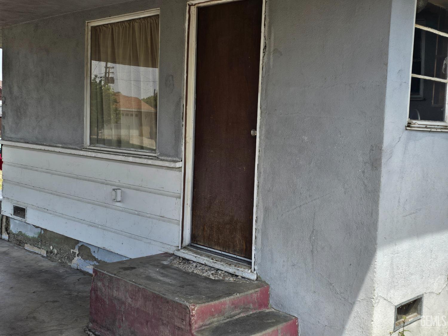 Undisclosed Address Bakersfield, CA 93304 - Photo 2 of 15 a front door view of a house