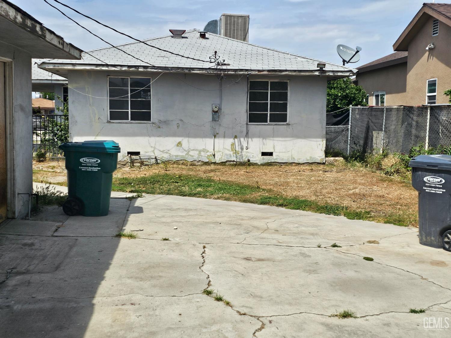 Undisclosed Address Bakersfield, CA 93304 - Photo 5 of 15 a front view of a house with a yard