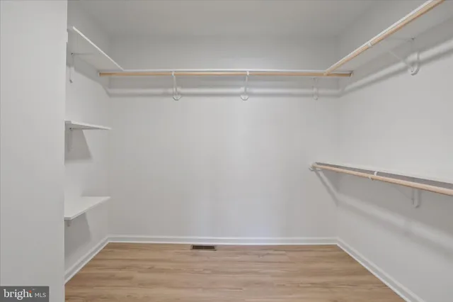 a view of an empty walk in closet