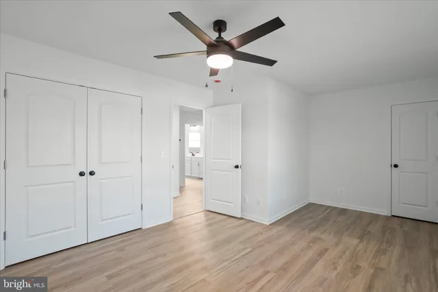 a view of an empty room and wooden floor