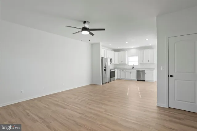 a view of a kitchen with a sink and cabinet area