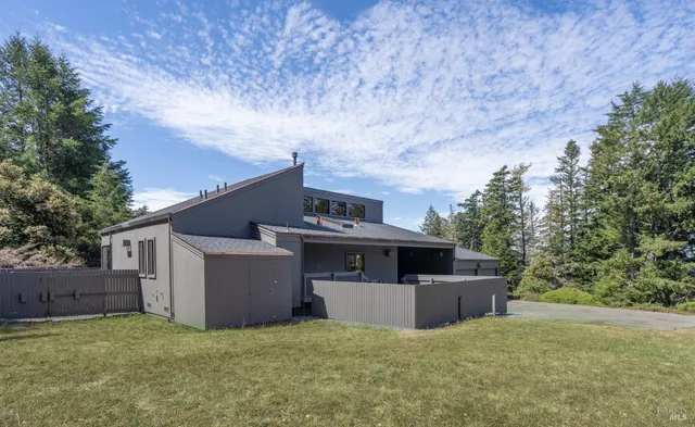 a view of a house with a patio and a garage