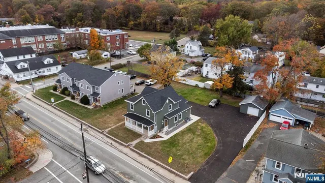 an aerial view of a house with a garden