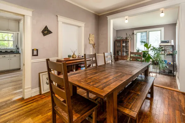 a dining room with furniture and window