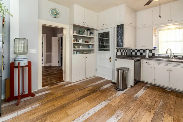 a kitchen with stainless steel appliances a stove and a refrigerator