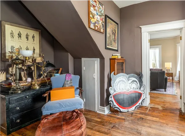 a room with furniture and wooden floor