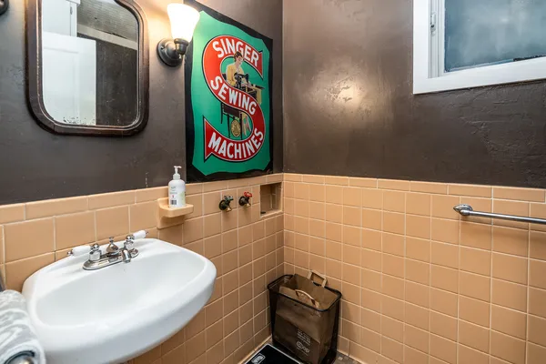 a bathroom with a sink a mirror and vanity