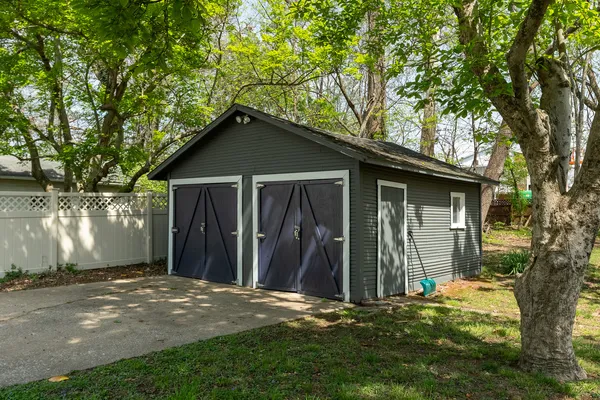 a backyard of a house with barbeque oven