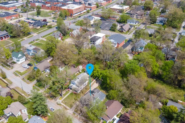 an aerial view of residential houses with outdoor space