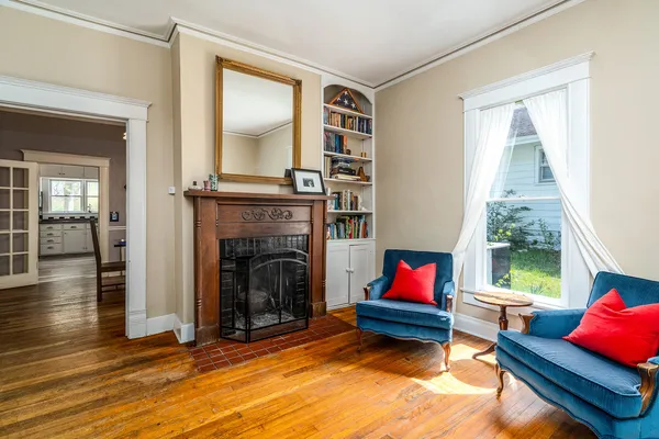 a living room with furniture and a fireplace