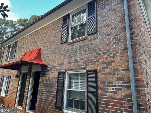 a front view of a building with windows