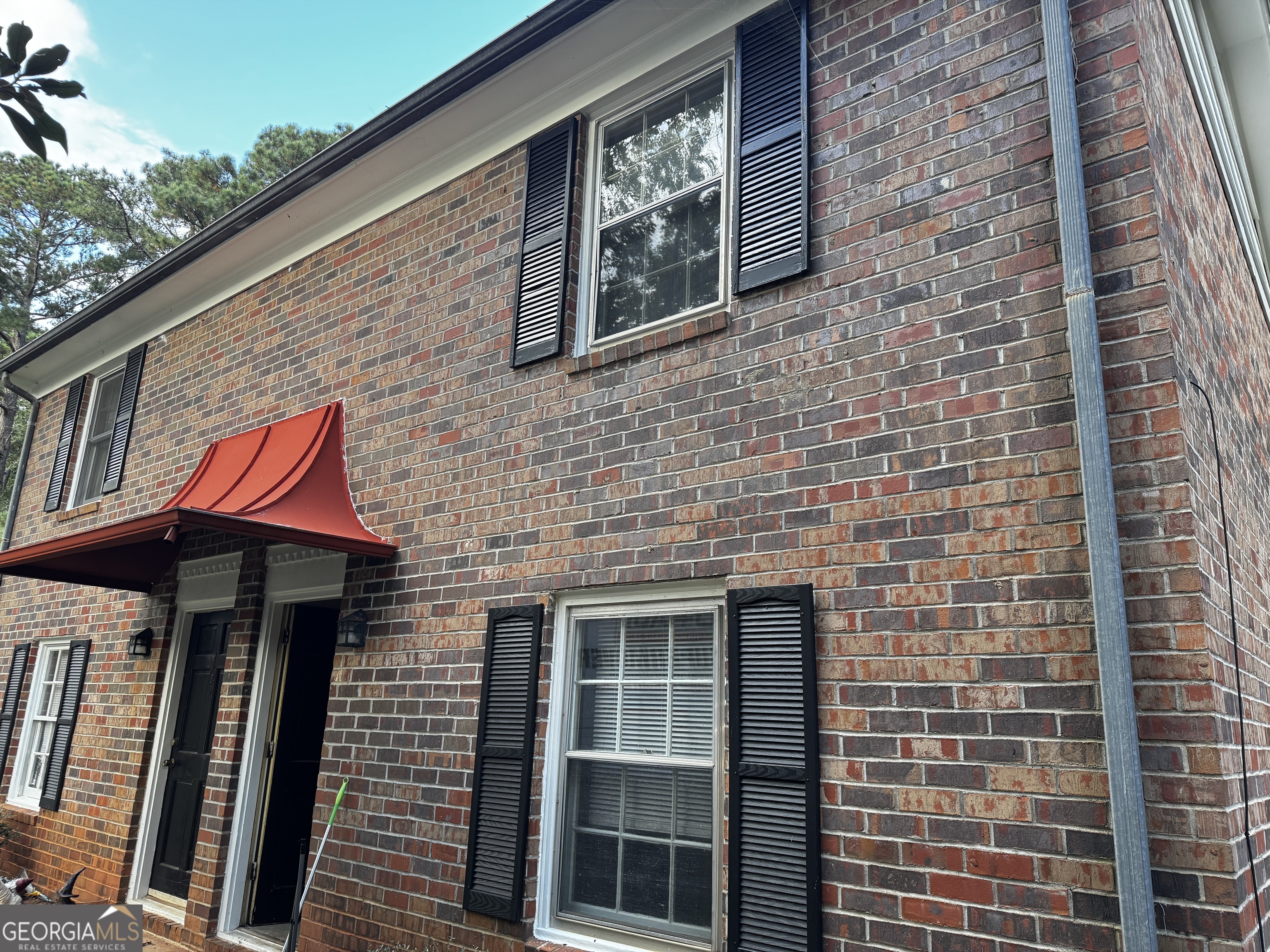 a front view of a building with windows