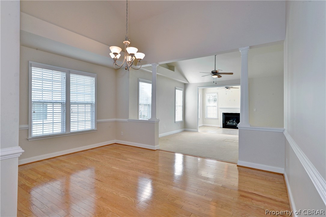 4244 Old Lock Road Williamsburg, VA 23188 - Photo 4 of 31 The dining room with hardwood floors and cathedral ceiling opens to the great room.