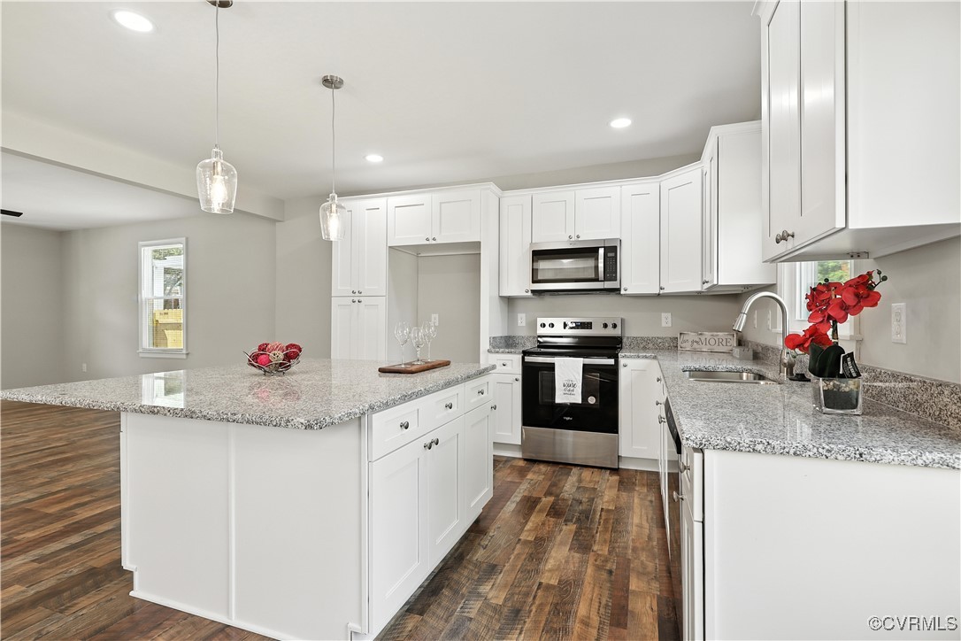 1409 Decatur Street Richmond, VA 23224 - Photo 19 of 33 Kitchen with stainless steel appliances, dark wood