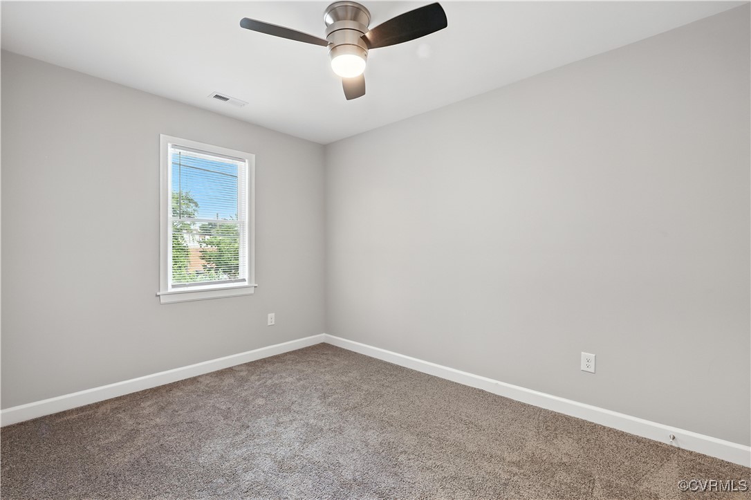 1409 Decatur Street Richmond, VA 23224 - Photo 27 of 33 Empty room with carpet floors and a ceiling fan
