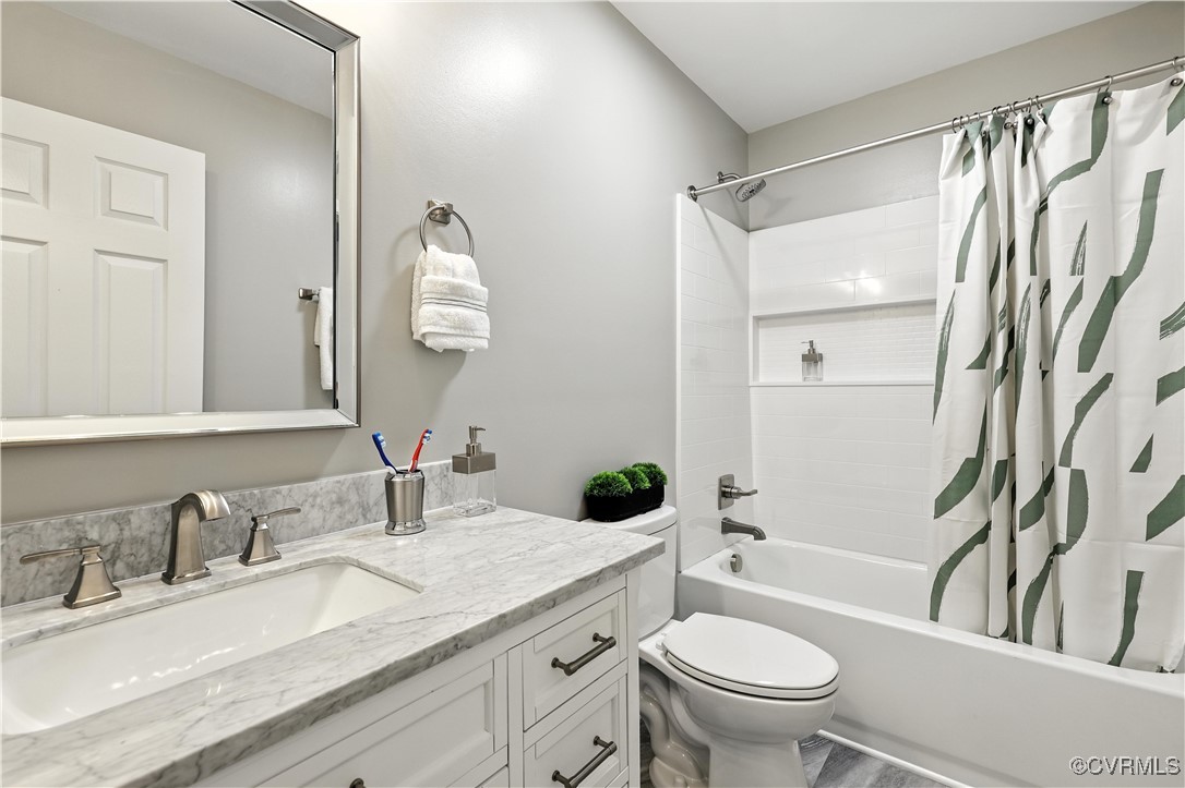 1409 Decatur Street Richmond, VA 23224 - Photo 29 of 33 Bathroom featuring vanity and shower / tub combo