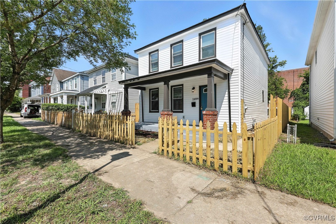 1409 Decatur Street Richmond, VA 23224 - Photo 9 of 33 Traditional-style house with a porch and a fenced