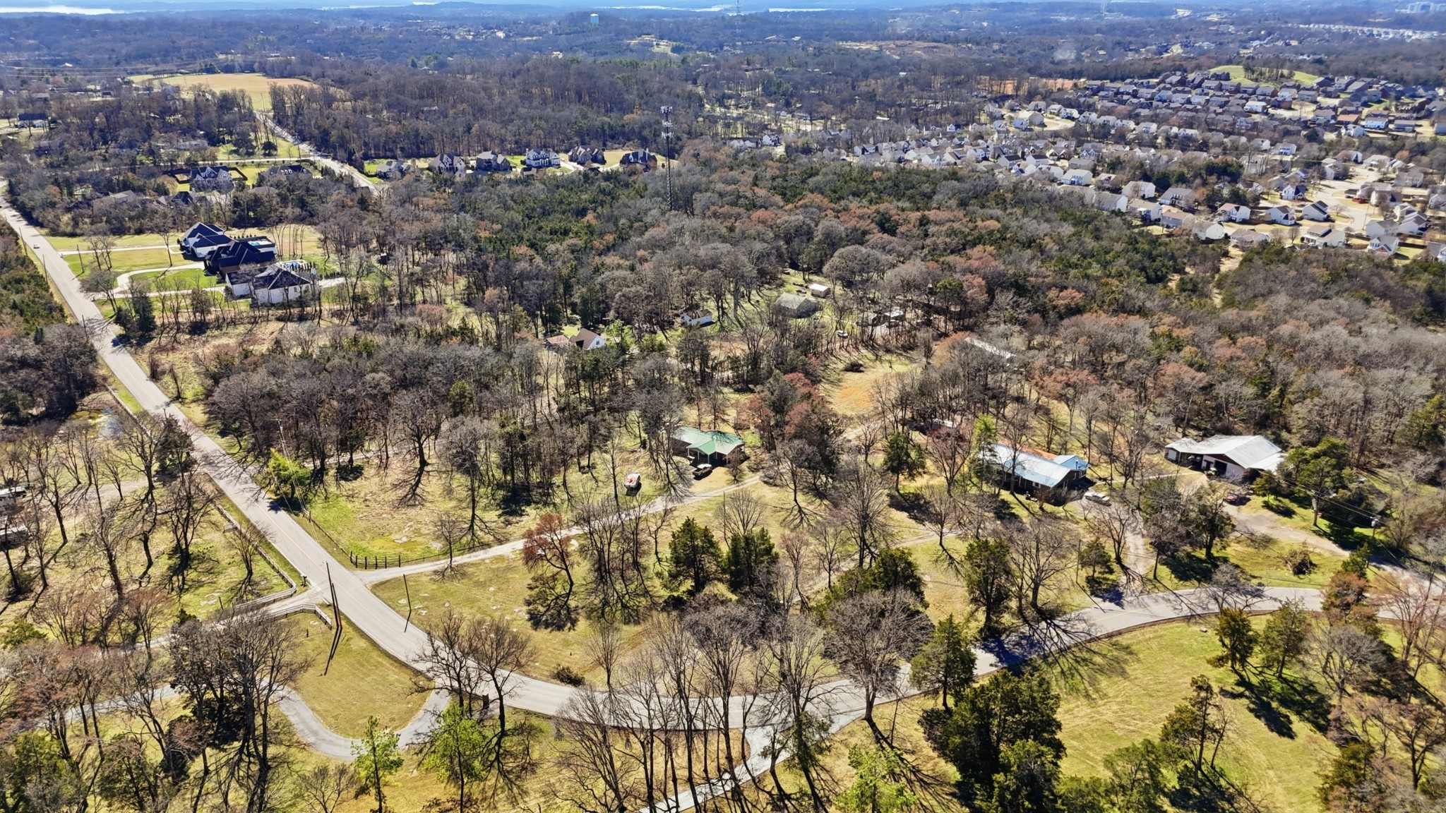 1076 Chandler Road Mount Juliet, TN 37122 - Photo 3 of 6 an aerial view of residential houses with city and green space