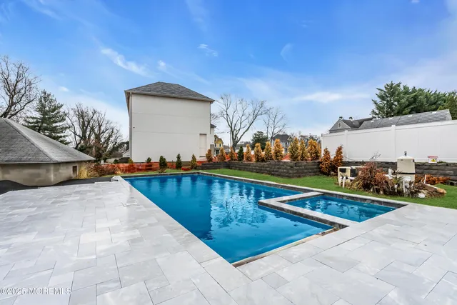 a view of swimming pool with chairs