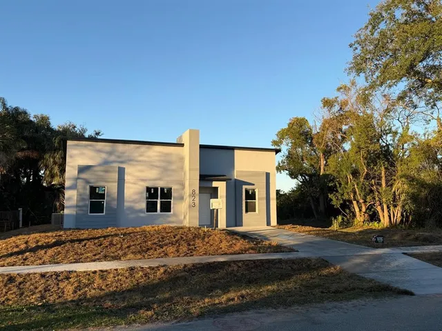 a large building with trees in front of it