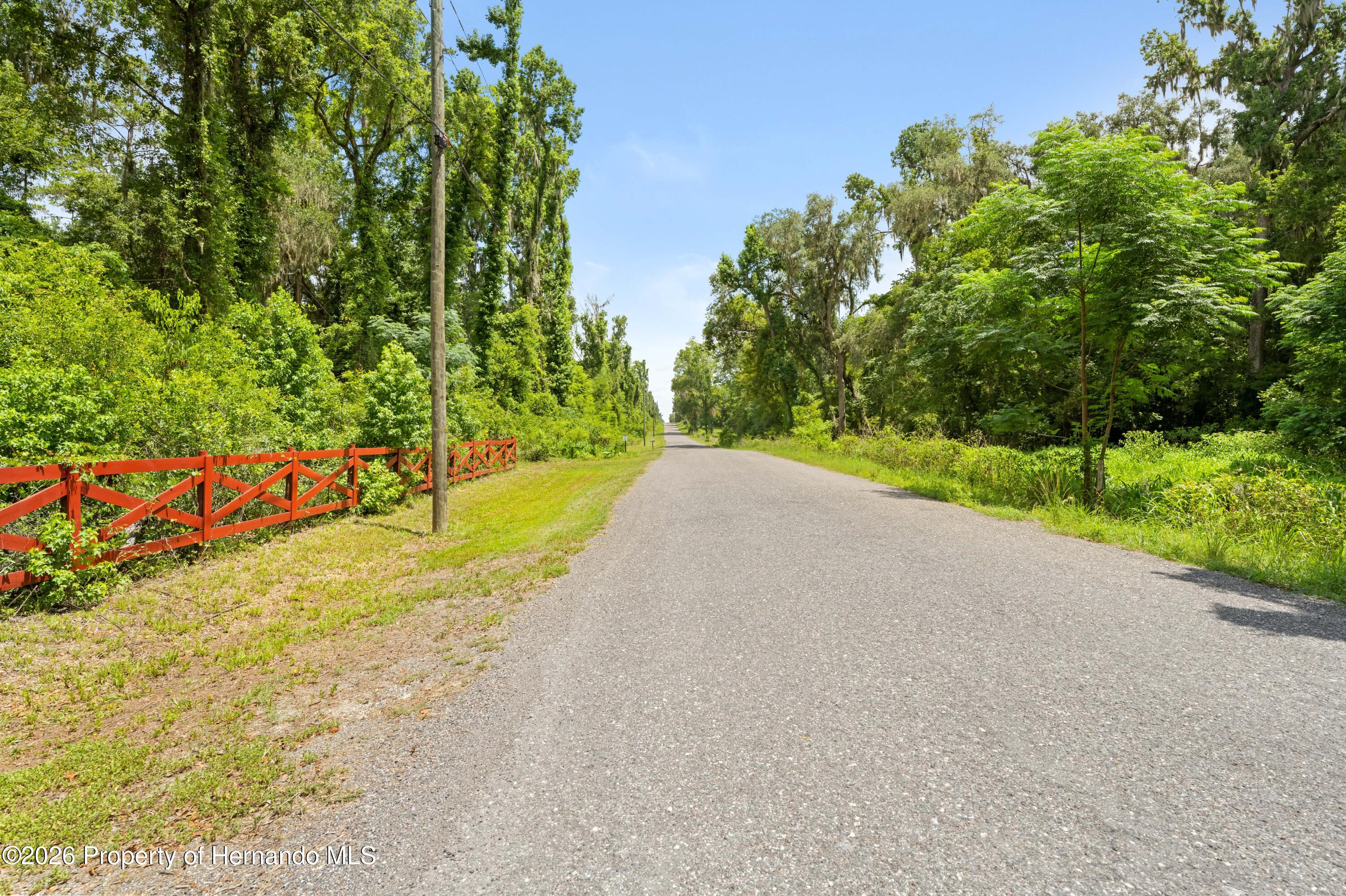 3311 Baseball Pond Road Brooksville, FL 34602 - Photo 18 of 18 a view of a road with a yard