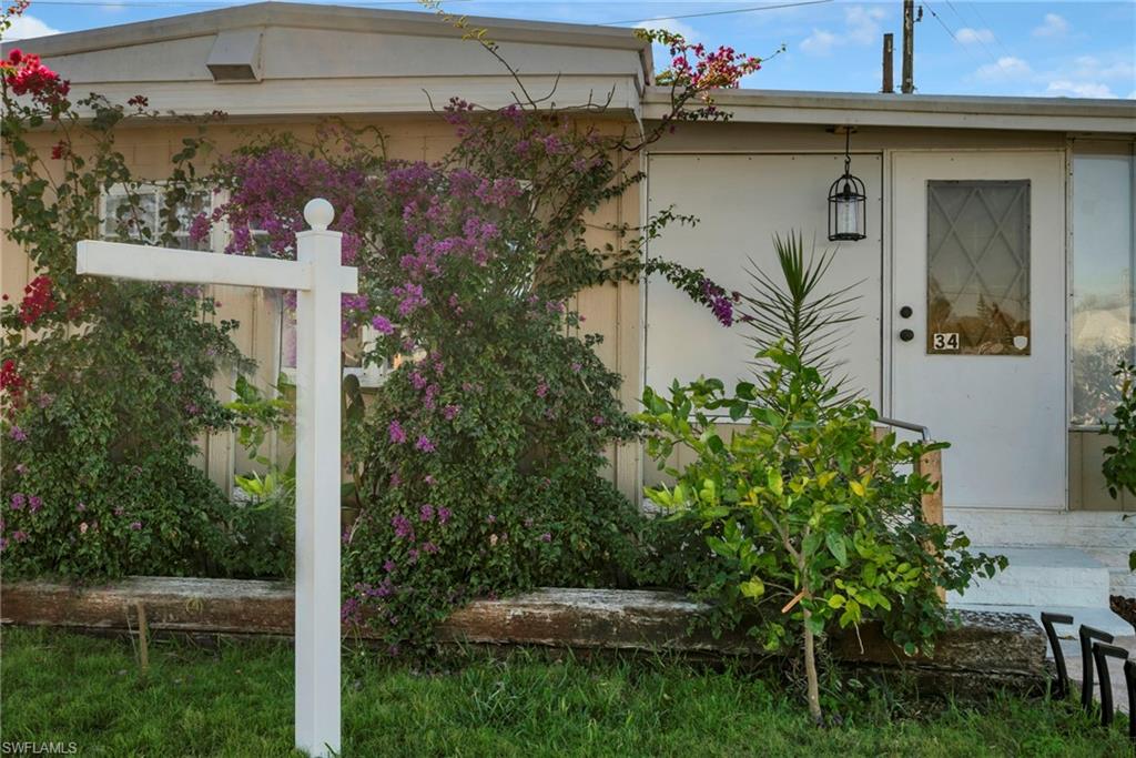 777 Walkerbilt Road, Unit 34 Naples, FL 34110 - Photo 3 of 23 Front of home