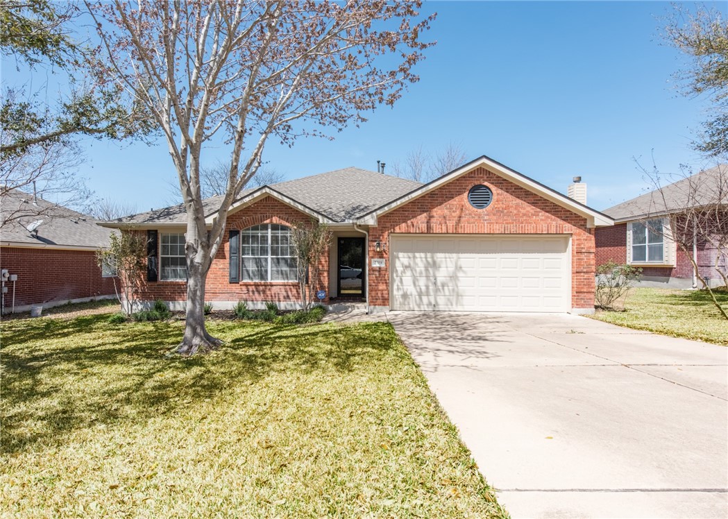 2319 Candle Ridge Trail Georgetown, TX 78626 - Photo 1 of 1 a front view of a house with a yard