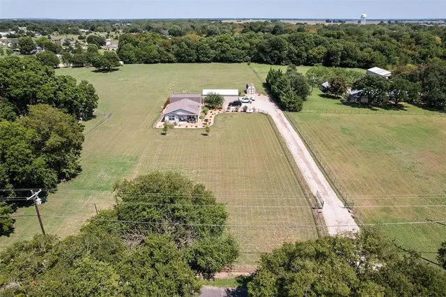 a view of a lake with a yard